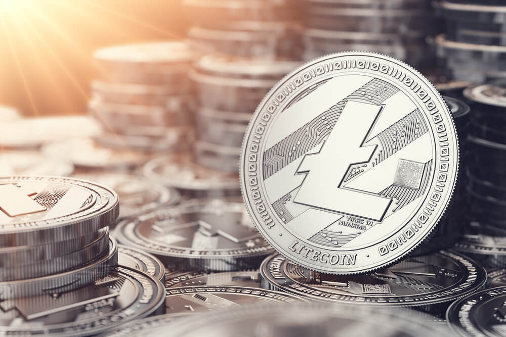 Silver litecoin with blurred background of litecoin.