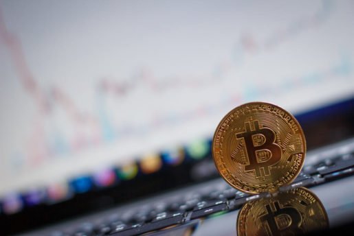 Bitcoin and blurred computer background.