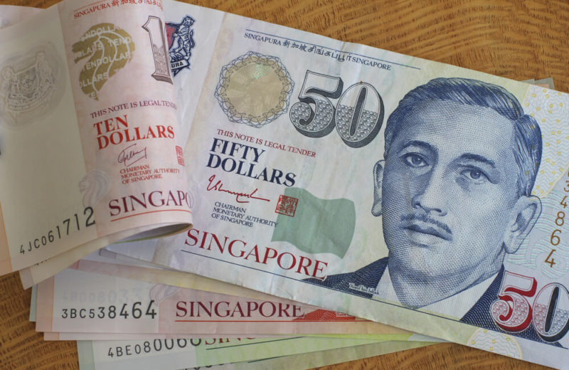 Singaporean Dollar Declines on Policy Easing Expectations