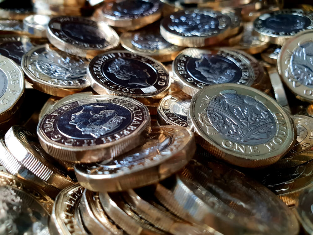 British Pound: Stacks of British one pound coins.