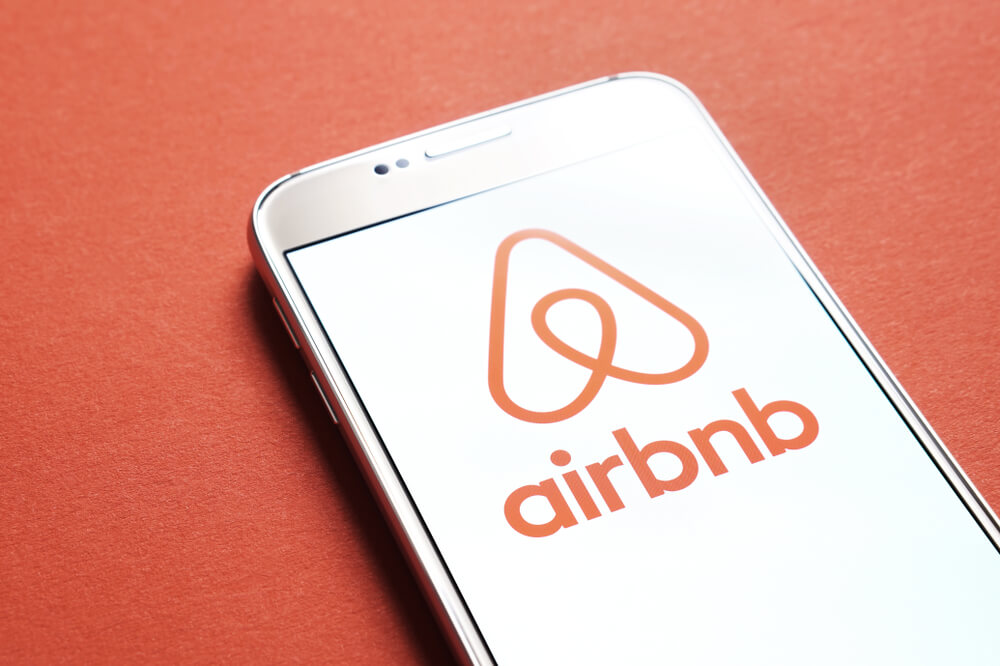 Airbnb logo with red background