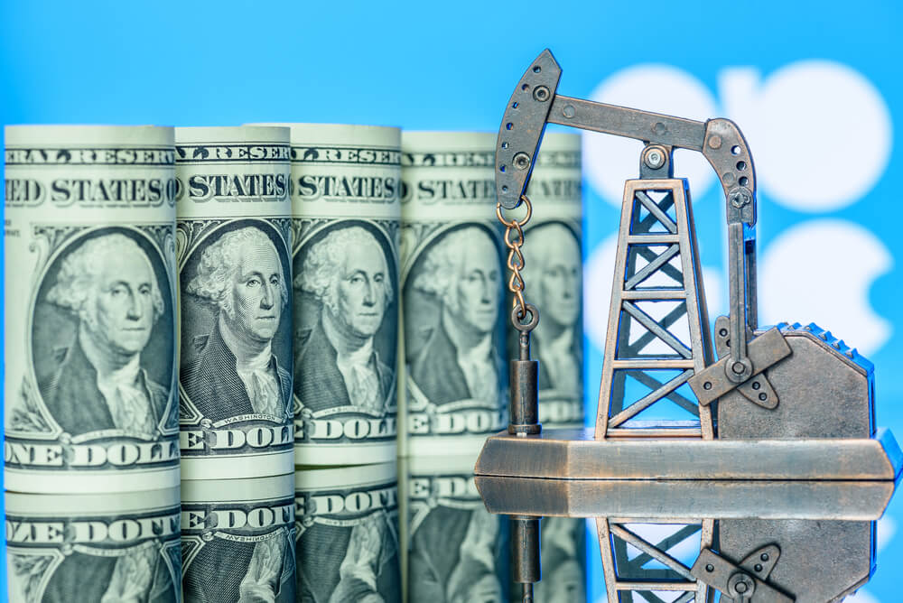 oil drilling machine with dollar on the background