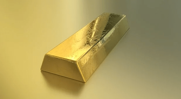 Gold Drops but Prepares for a Weekly Gain