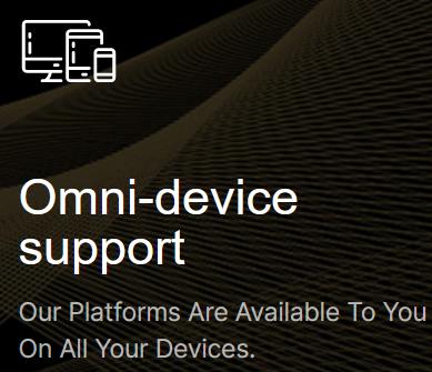 An image showcasing the text "Omni-device support" with a subheading "Our platforms are available to you on all your devices," accompanied by icons of a desktop computer and a mobile device, set against a dark, textured background. This suggests the cross-compatibility and multi-device accessibility of the featured platforms.